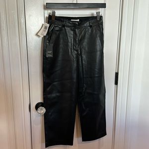 Babaton cropped faux, leather black pants. Mid rise Straight size  2 crop